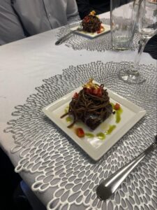 Artfully plated dessert served at a private event inside Ovico Gallery, a wall art gallery in St. Augustine known for blending fine art prints with curated cultural experiences.